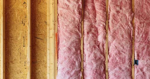 Image: insulation batting along attic walls.